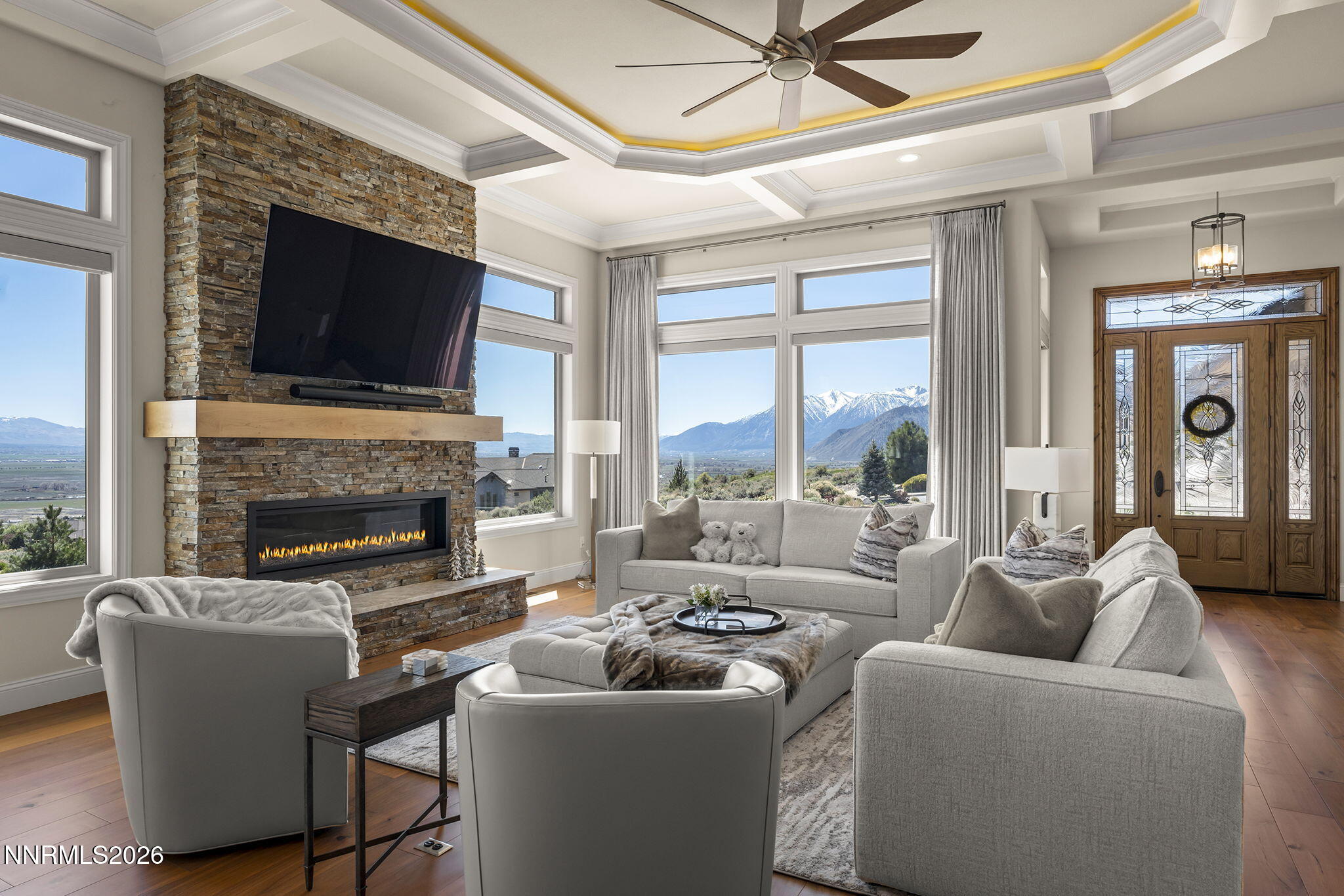 342 James Canyon Loop Genoa, NV 89411 - Photo 8 of 51 a living room with furniture a fireplace and a flat screen tv