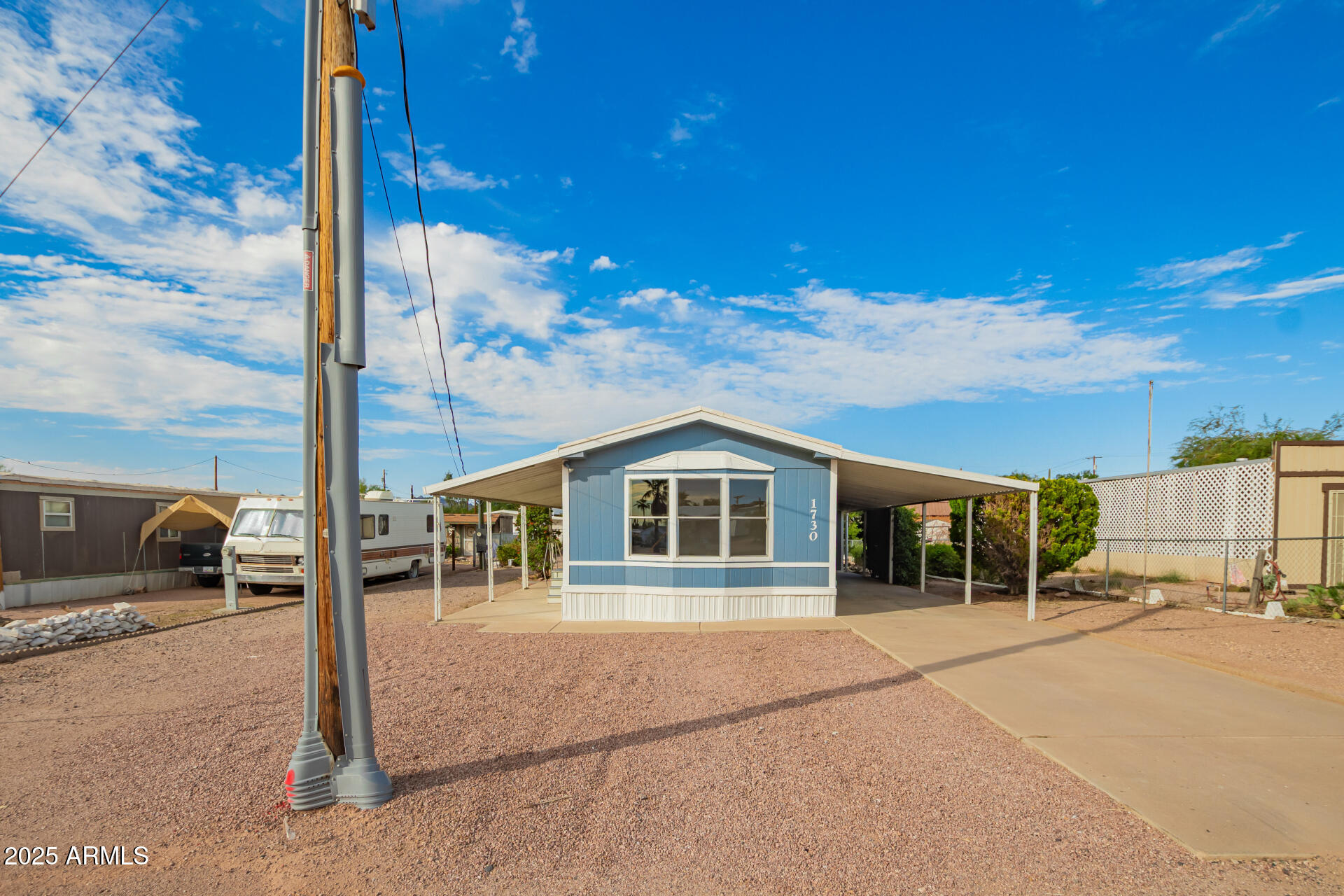1730 East 21st Avenue Apache Junction, AZ 85119 - Photo 1 of 25 a view of a house with a outdoor space