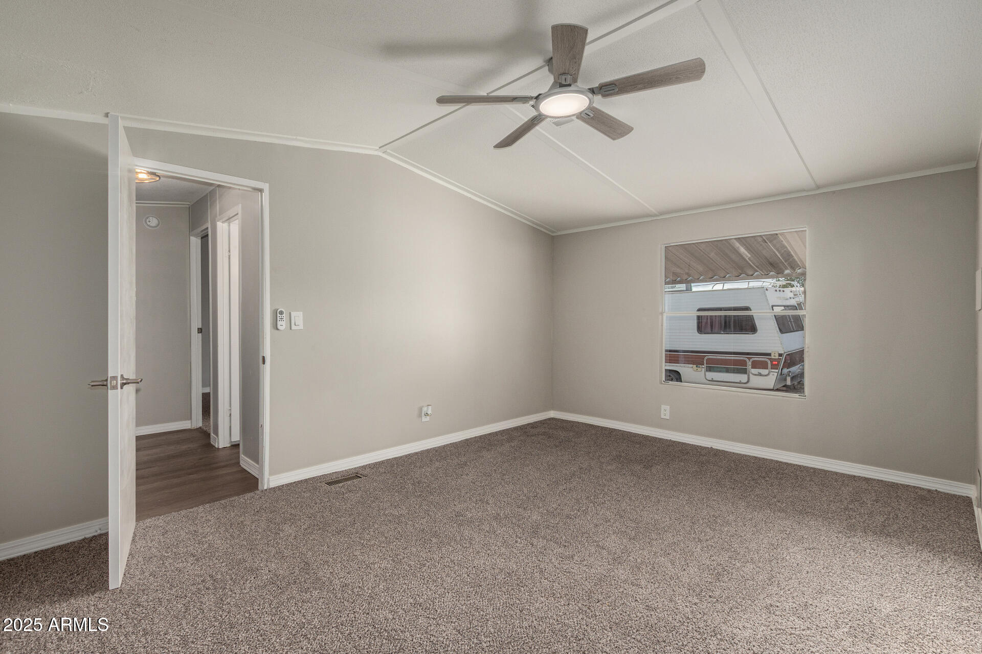 1730 East 21st Avenue Apache Junction, AZ 85119 - Photo 13 of 25 a view of an empty room with a window