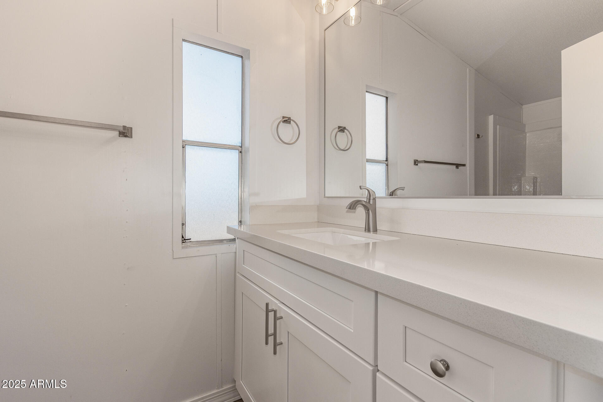 1730 East 21st Avenue Apache Junction, AZ 85119 - Photo 14 of 25 a bathroom with a sink and a mirror