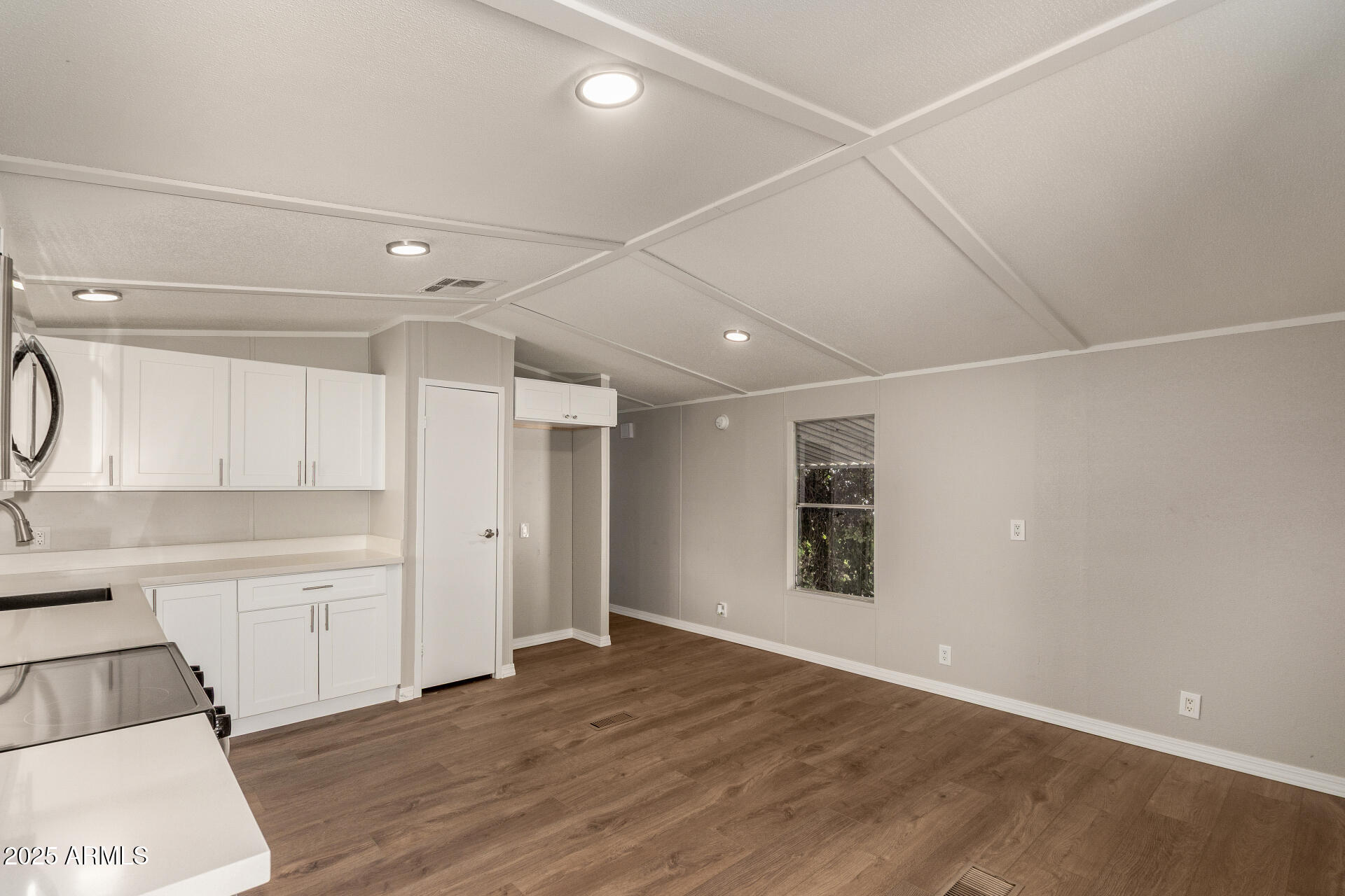 1730 East 21st Avenue Apache Junction, AZ 85119 - Photo 3 of 25 a view of a kitchen with wooden cabinet and a sink