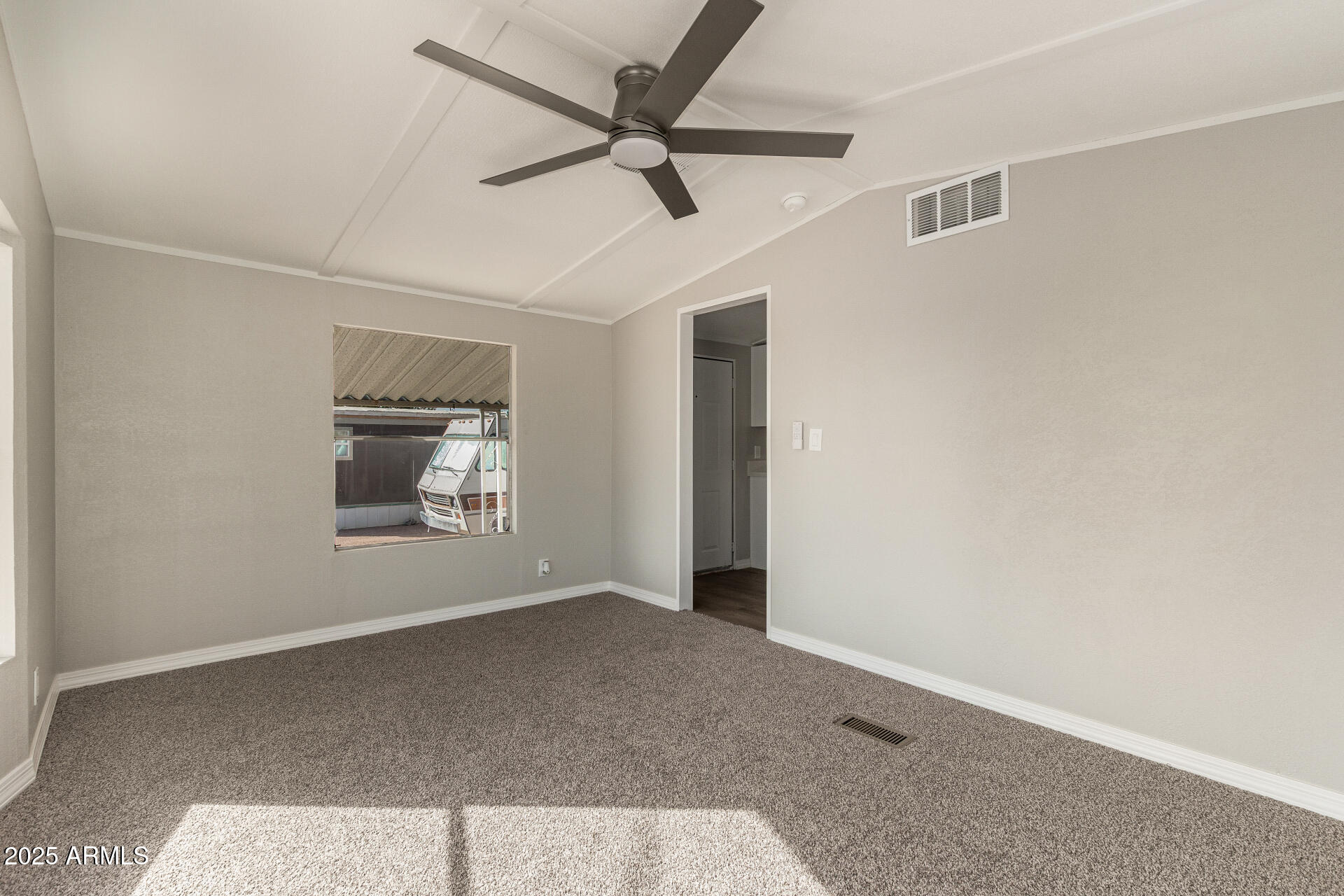 1730 East 21st Avenue Apache Junction, AZ 85119 - Photo 8 of 25 a view of an empty room with a window