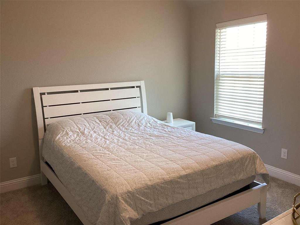 5984 Bursey Road Watauga, TX 76148 - Photo 15 of 21 Room featuring neutral wall tones, window with horizontal blinds, and carpet flooring