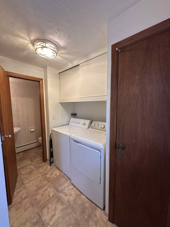 96 Coventry Circle, Unit 96 Brockton, MA 02301 - Photo 4 of 13 a room with a washer and dryer