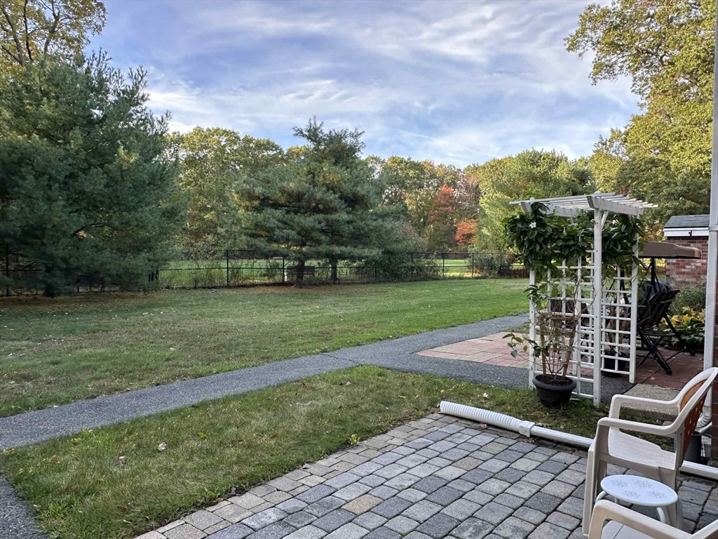 96 Coventry Circle, Unit 96 Brockton, MA 02301 - Photo 7 of 13 a view of a garden with a bench in a park