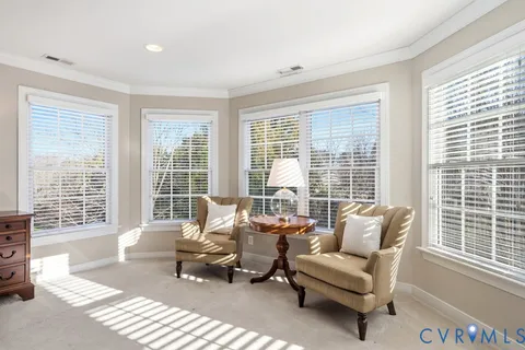 a living room with furniture and windows