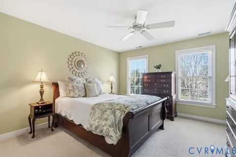 a bedroom with a bed and a table in it