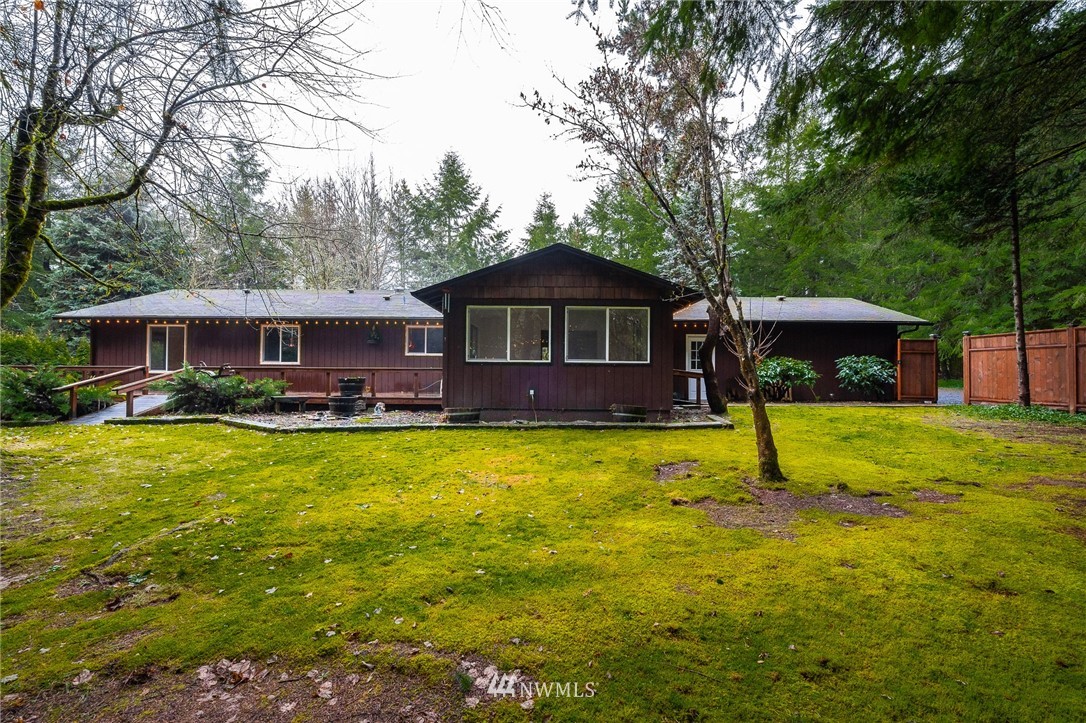 191 Tingle Road Winlock, WA 98596 - Photo 1 of 39 a front view of a house with a yard table and chairs