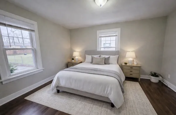 a bedroom with a bed and window