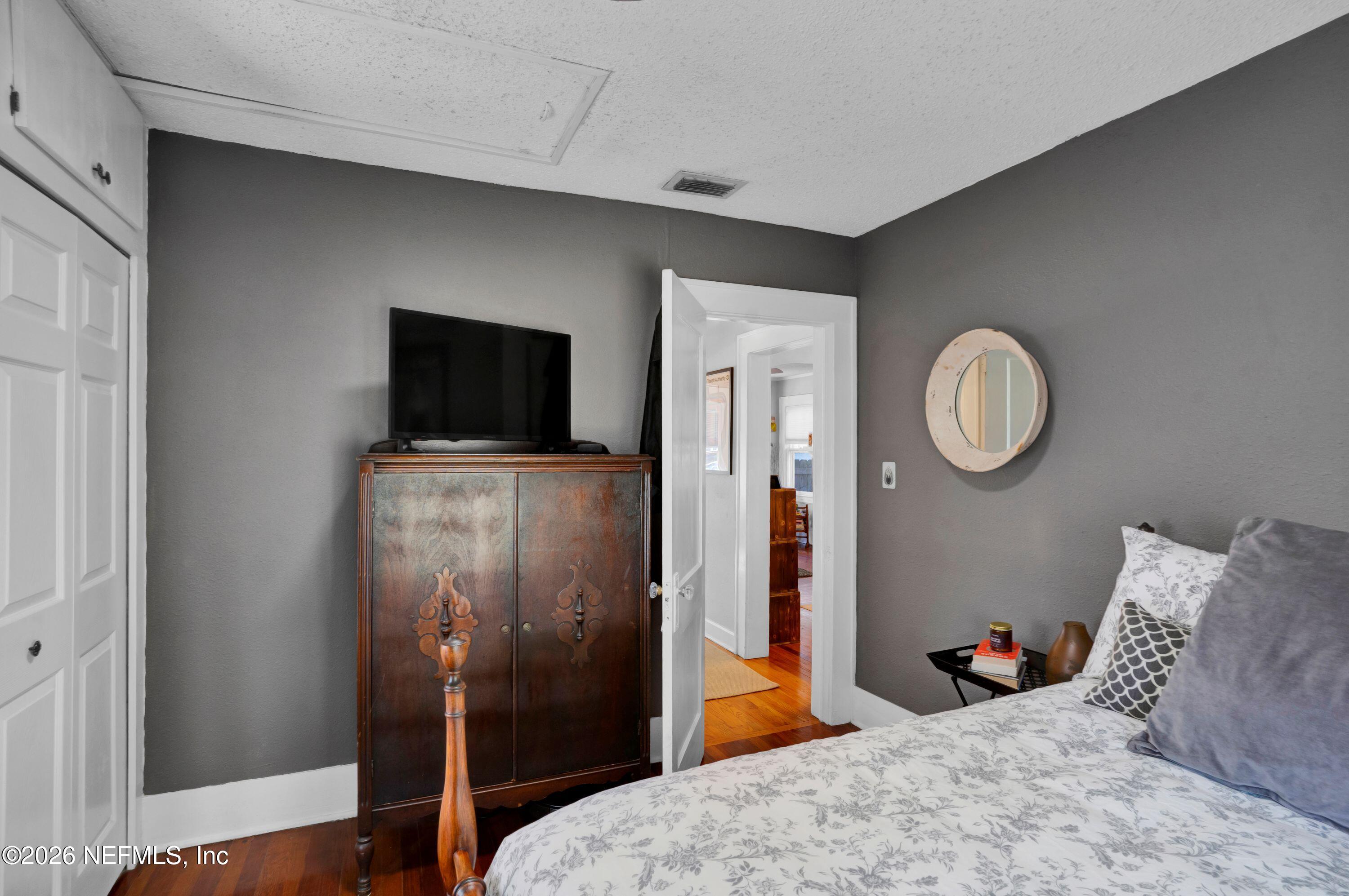 1273 Dancy Street Jacksonville, FL 32205 - Photo 23 of 30 a bedroom with bed and a mirror