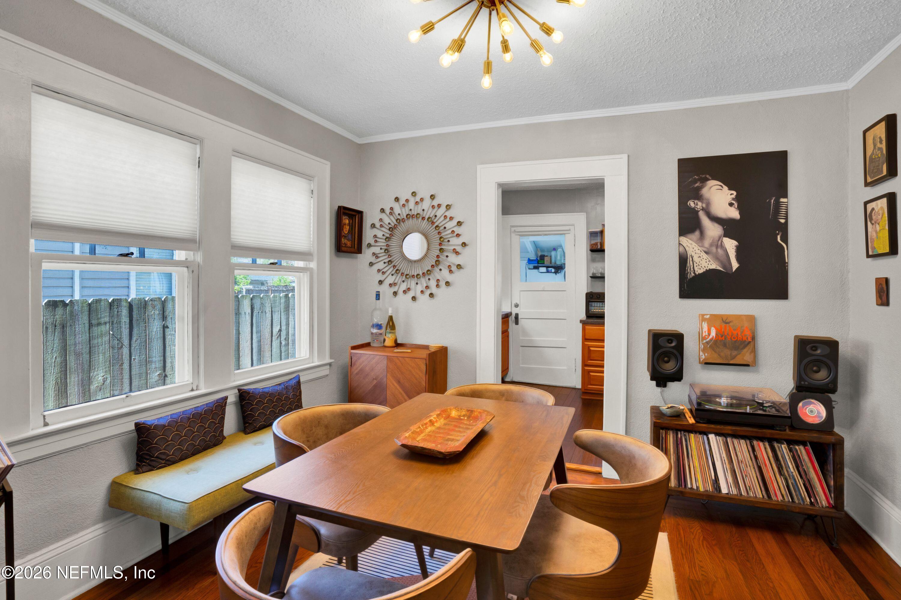1273 Dancy Street Jacksonville, FL 32205 - Photo 10 of 30 a view of a dining room with furniture a chandelier and wooden floor