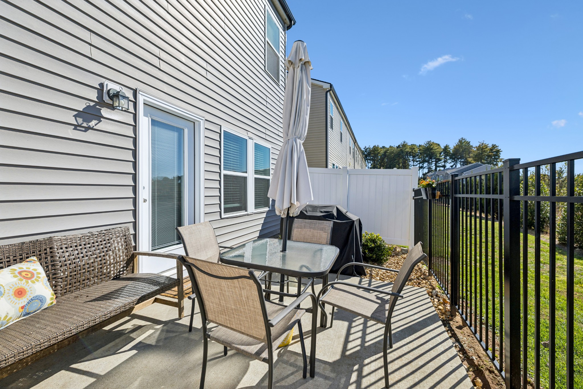 359 Coleman Court Columbia, TN 38401 - Photo 23 of 24 a view of a patio with a table and chairs and a barbeque