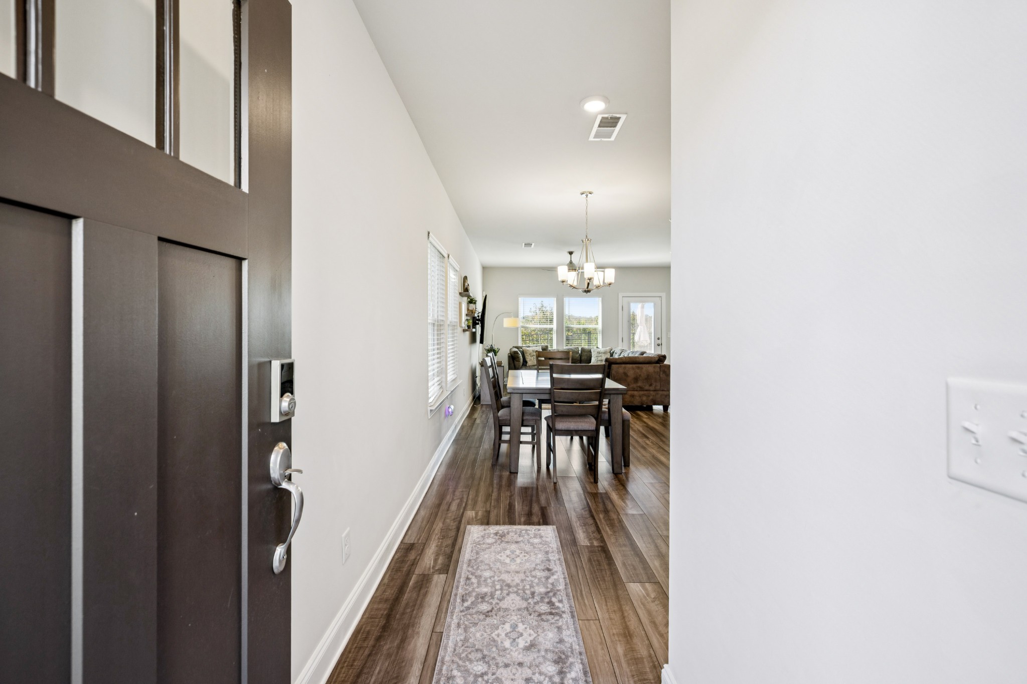 359 Coleman Court Columbia, TN 38401 - Photo 4 of 24 a view of a hallway with a tables and chairs