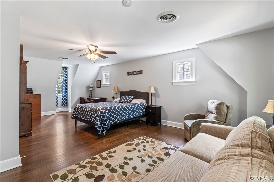 2320 Dorking Road North Chesterfield, VA 23236 - Photo 22 of 42 a bedroom with a bed couch and a chandelier