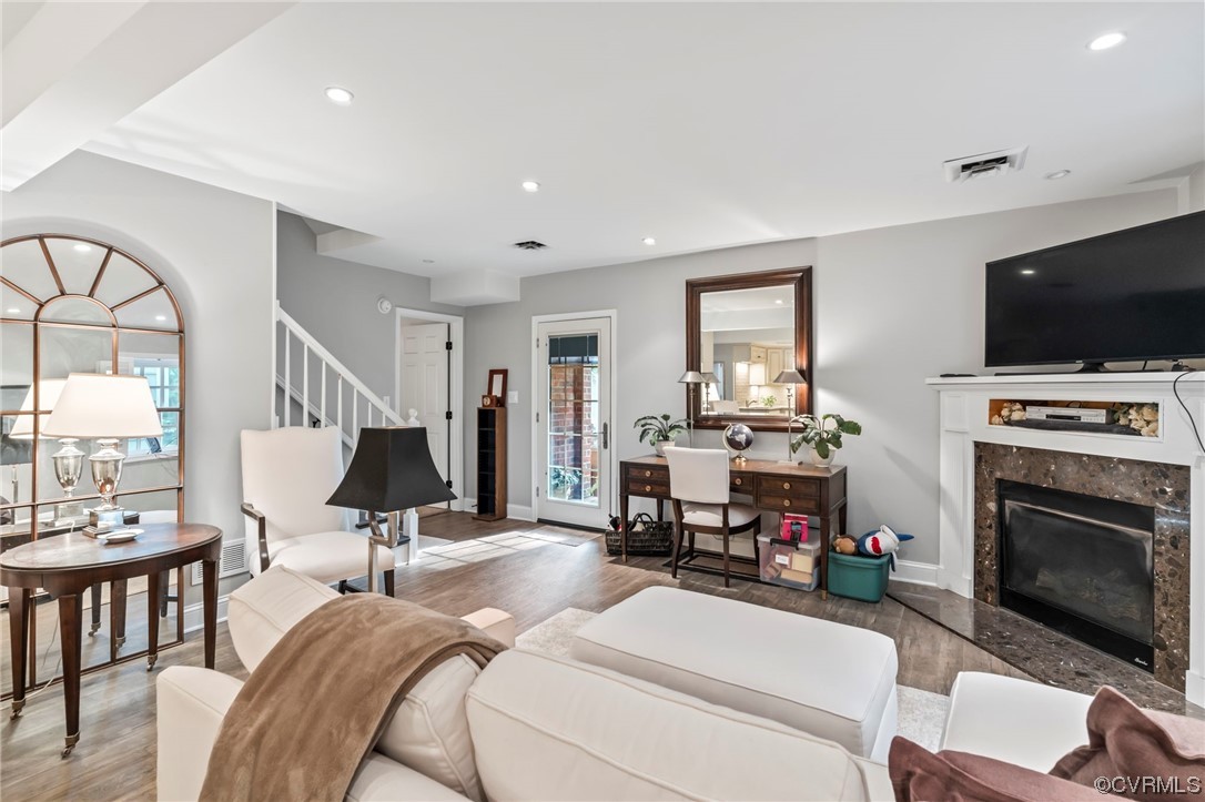 2320 Dorking Road North Chesterfield, VA 23236 - Photo 29 of 42 a living room with furniture a fireplace and a flat screen tv