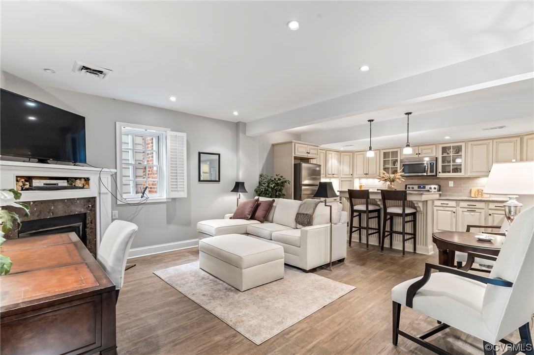 2320 Dorking Road North Chesterfield, VA 23236 - Photo 42 of 42 a living room with furniture a flat screen tv and kitchen view