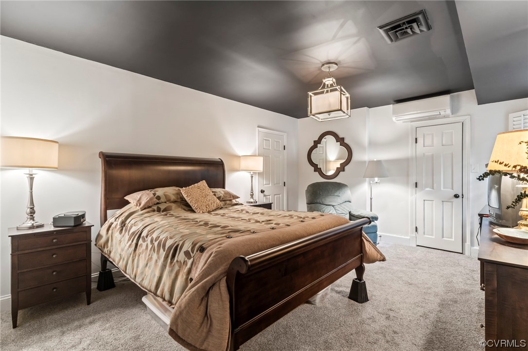 2320 Dorking Road North Chesterfield, VA 23236 - Photo 33 of 42 a bed room with a bed and a chandelier