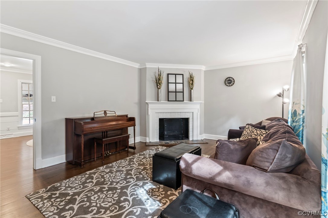 2320 Dorking Road North Chesterfield, VA 23236 - Photo 7 of 42 a living room with furniture a rug and a fireplace