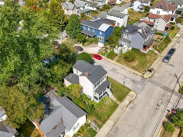 an aerial view of a house with a garden