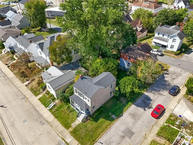 an aerial view of a house with a garden