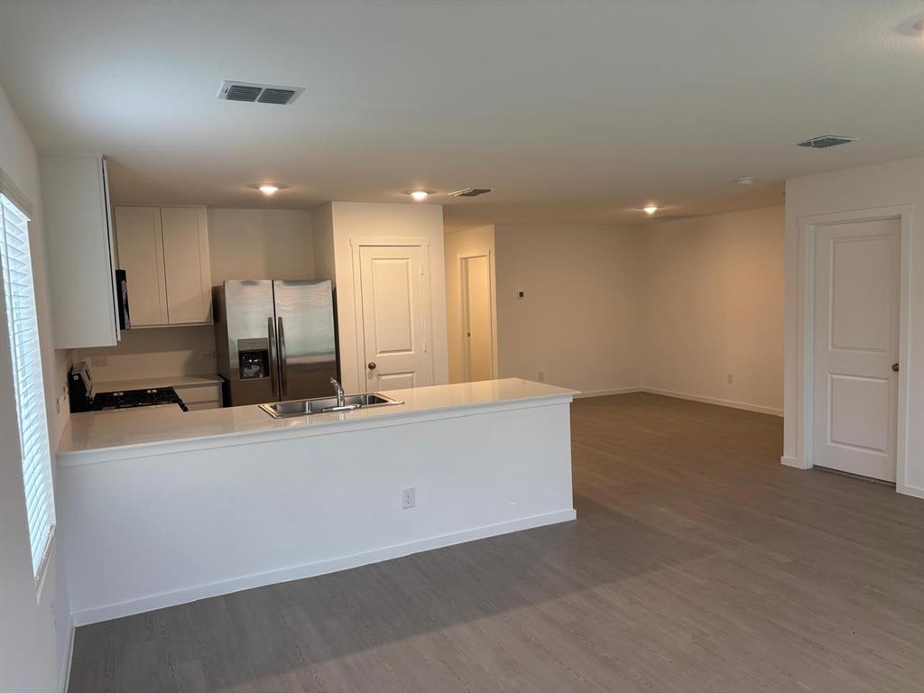 9204 Schram Road Fort Worth, TX 76179 - Photo 7 of 17 Open-concept living area featuring light wood-finish flooring