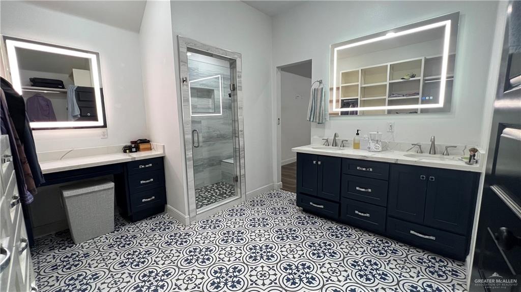 433 Redbud Avenue McAllen, TX 78504 - Photo 6 of 11 a bathroom with a sink vanity granite and a mirror