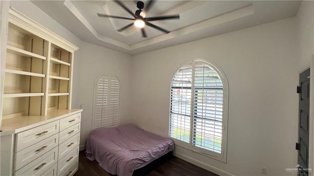 433 Redbud Avenue McAllen, TX 78504 - Photo 8 of 11 a bedroom with a bed and a window