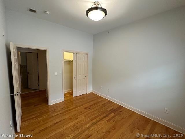 2518 Whitney Avenue, Unit 3 Hamden, CT 06518 - Photo 12 of 14 wooden floor in an empty room