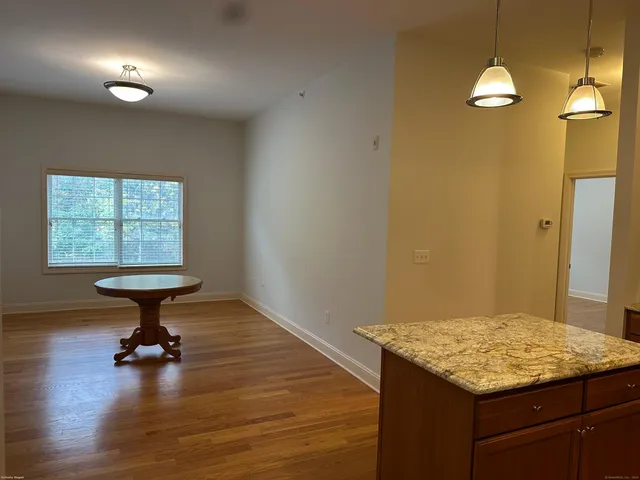a kitchen that has a table and a stove