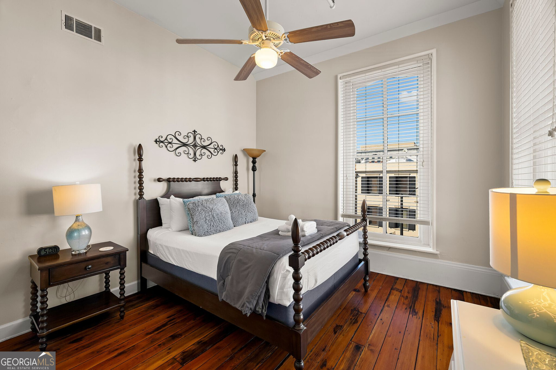 105 Whitaker Street, Unit 302 Savannah, GA 31401 - Photo 12 of 39 a bedroom with a bed and a window