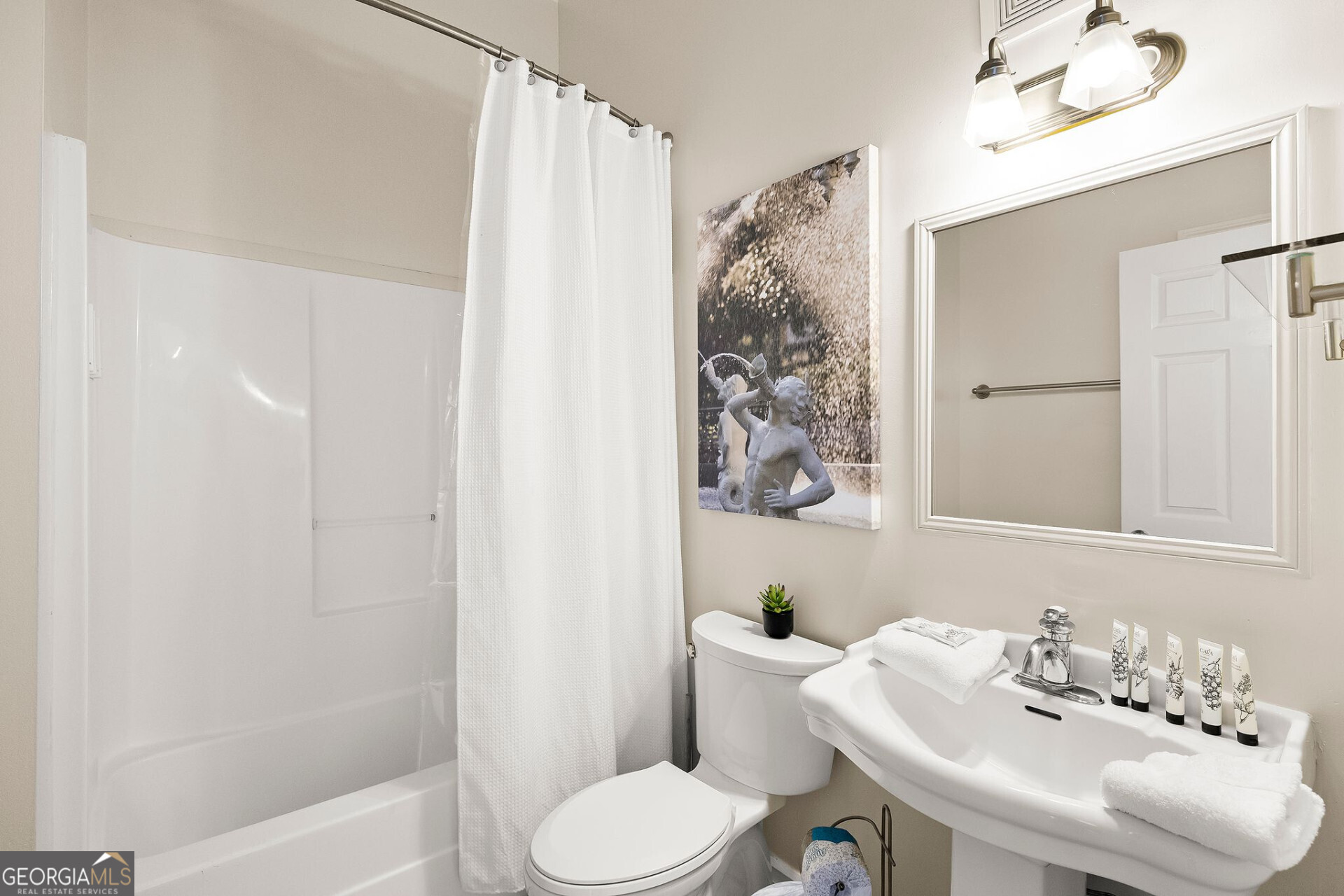 105 Whitaker Street, Unit 302 Savannah, GA 31401 - Photo 14 of 39 a bathroom with a sink toilet and shower