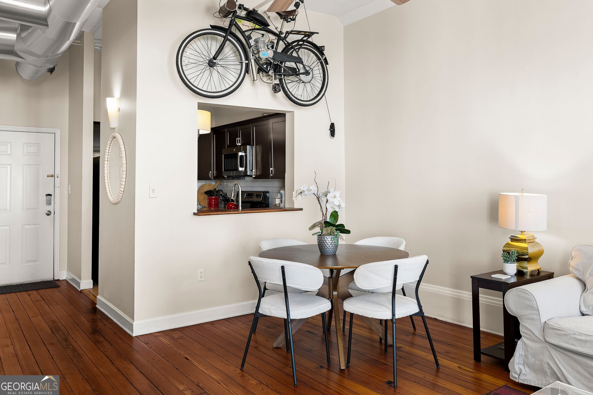 105 Whitaker Street, Unit 302 Savannah, GA 31401 - Photo 27 of 39 a view of a dining room with furniture and wooden floor
