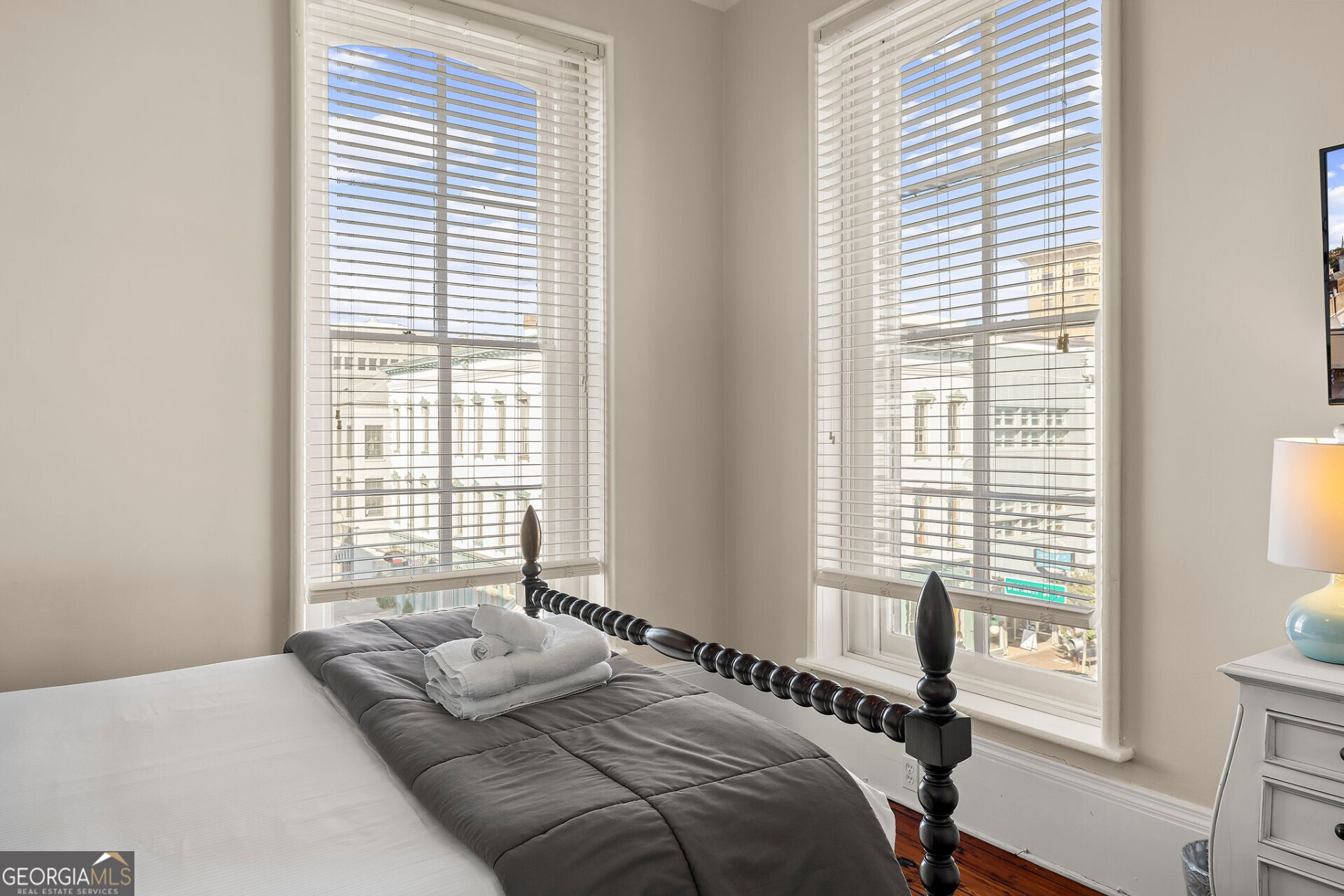 105 Whitaker Street, Unit 302 Savannah, GA 31401 - Photo 32 of 39 a bedroom with a bed and a window