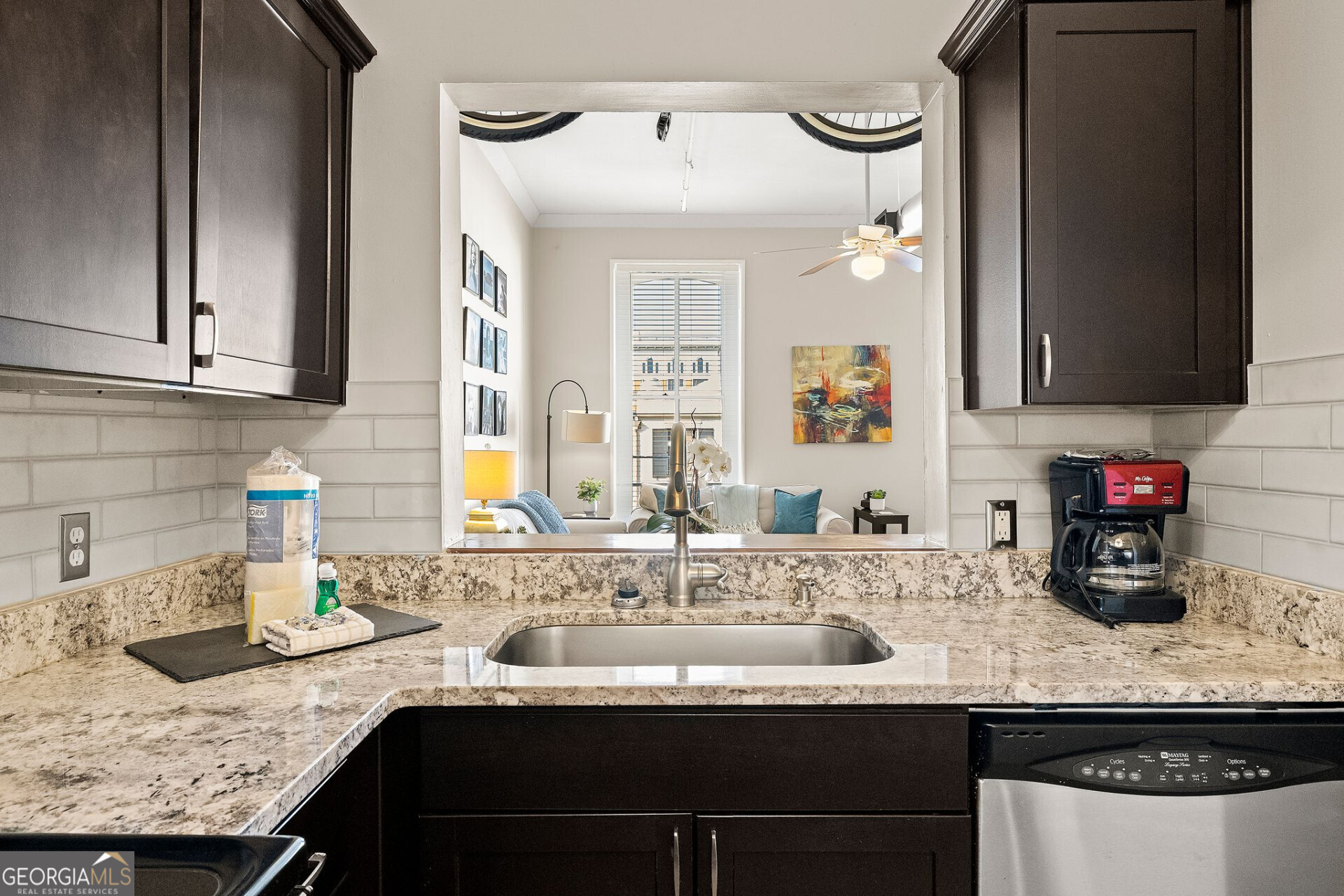 105 Whitaker Street, Unit 302 Savannah, GA 31401 - Photo 4 of 39 a kitchen with a sink and a cabinets