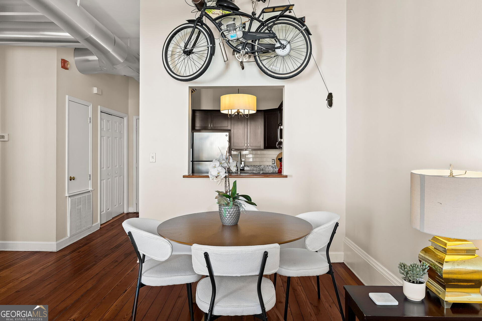 105 Whitaker Street, Unit 302 Savannah, GA 31401 - Photo 5 of 39 a view of a dining room with furniture and wooden floor