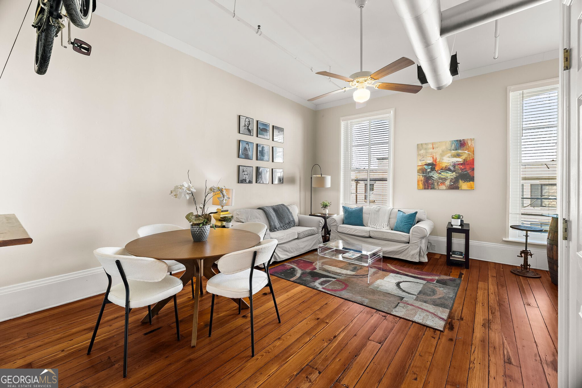 105 Whitaker Street, Unit 302 Savannah, GA 31401 - Photo 7 of 39 a living room with furniture and a wooden floor