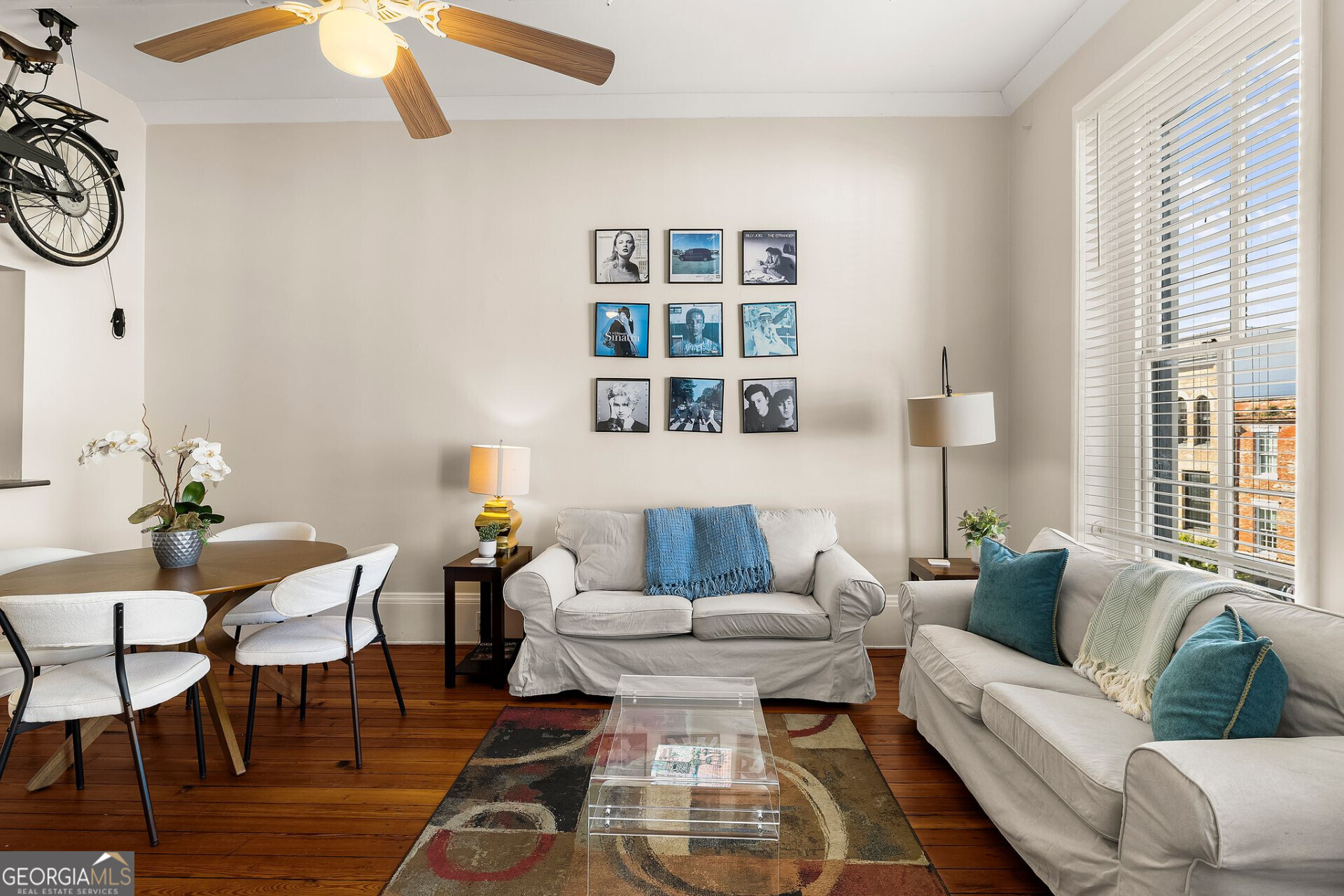 105 Whitaker Street, Unit 302 Savannah, GA 31401 - Photo 8 of 39 a living room with furniture a rug and a window