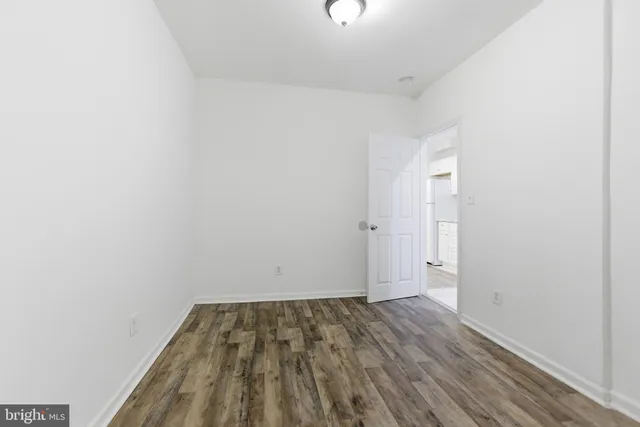 a view of room with wooden floor