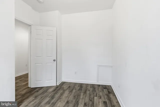 a view of a room with wooden floor and closet