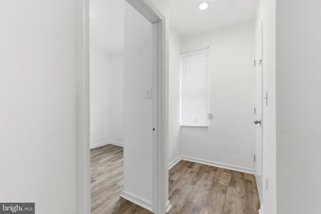a view of room with wooden floor