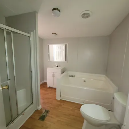 a bathroom with a toilet and shower