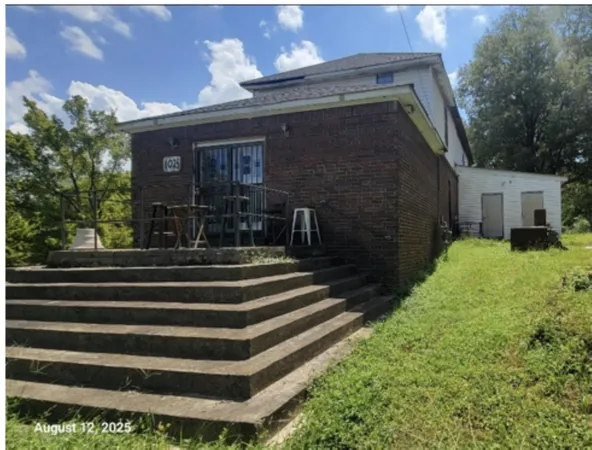 a view of a room with wooden walls