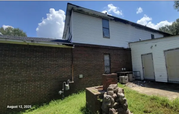 a view of a room with furniture and window
