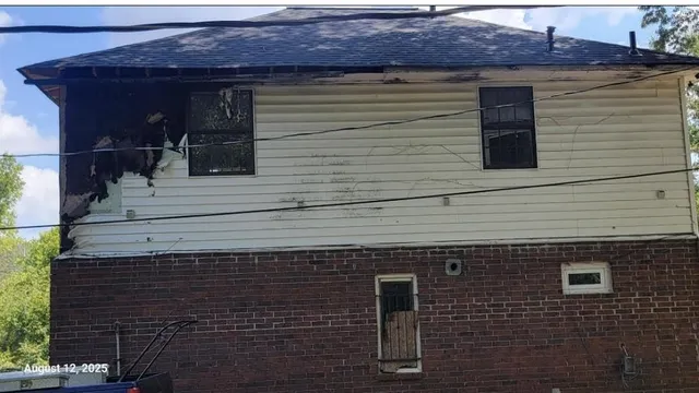 a view of a livingroom with an empty space and a window