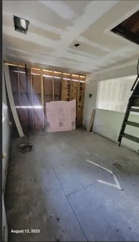 a view of a room with furniture and window