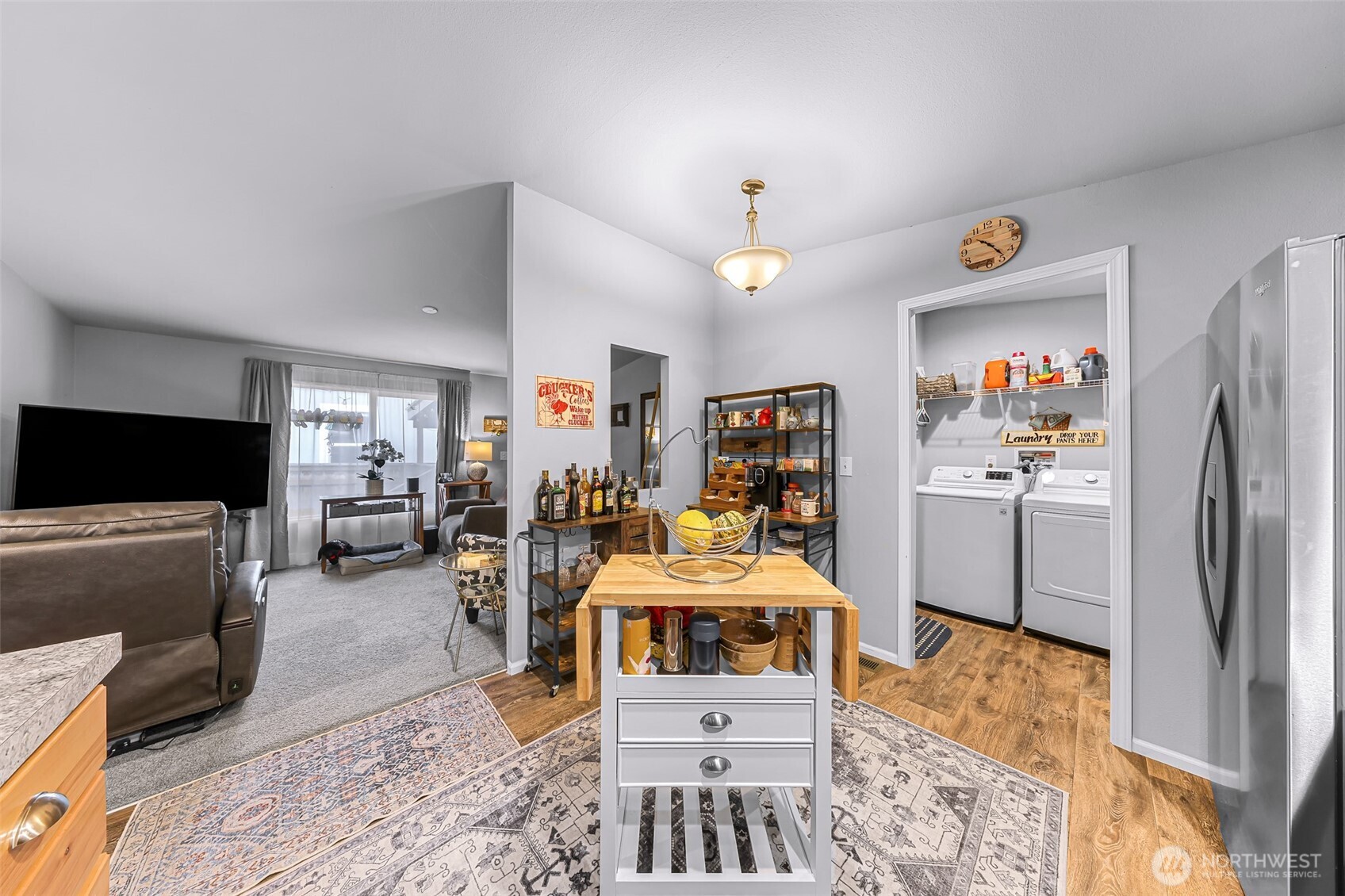 2392 Douglas Road, Unit 57 Ferndale, WA 98248 - Photo 13 of 26 a living room with furniture and a flat screen tv