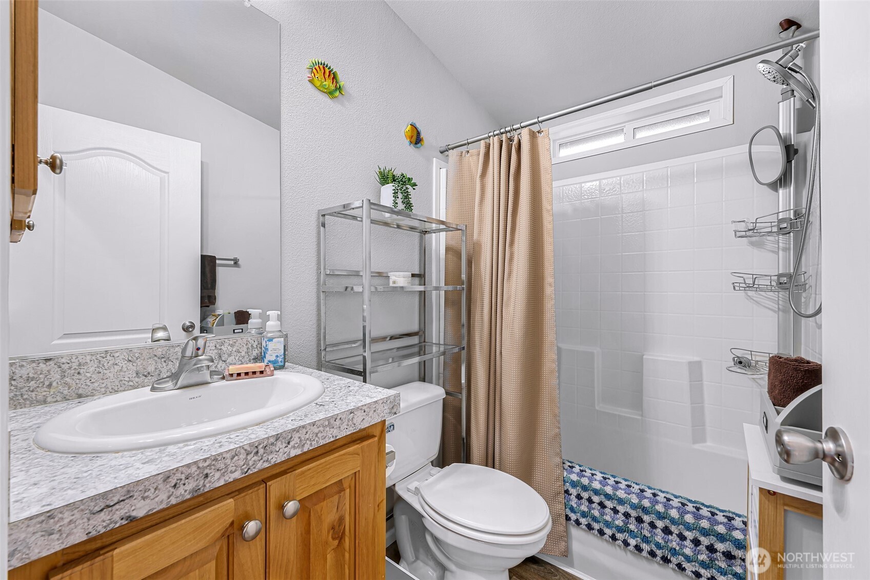 2392 Douglas Road, Unit 57 Ferndale, WA 98248 - Photo 16 of 26 a bathroom with a granite countertop sink toilet and shower