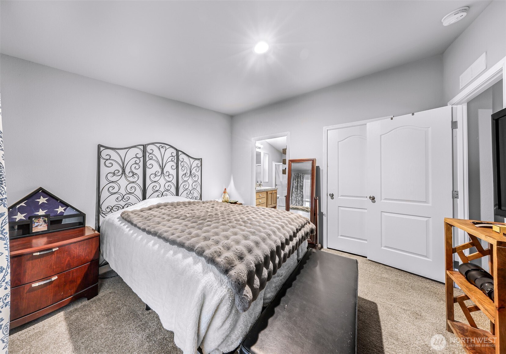 2392 Douglas Road, Unit 57 Ferndale, WA 98248 - Photo 19 of 26 a bedroom with a bed and a dresser