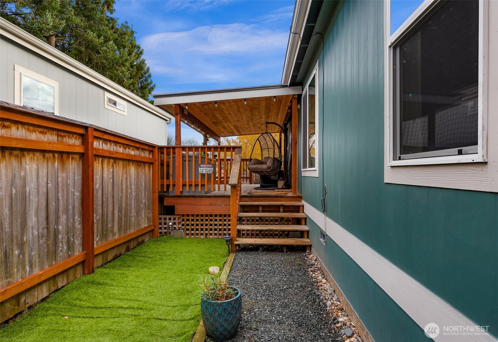 2392 Douglas Road, Unit 57 Ferndale, WA 98248 - Photo 2 of 26 a view of a backyard with sitting area