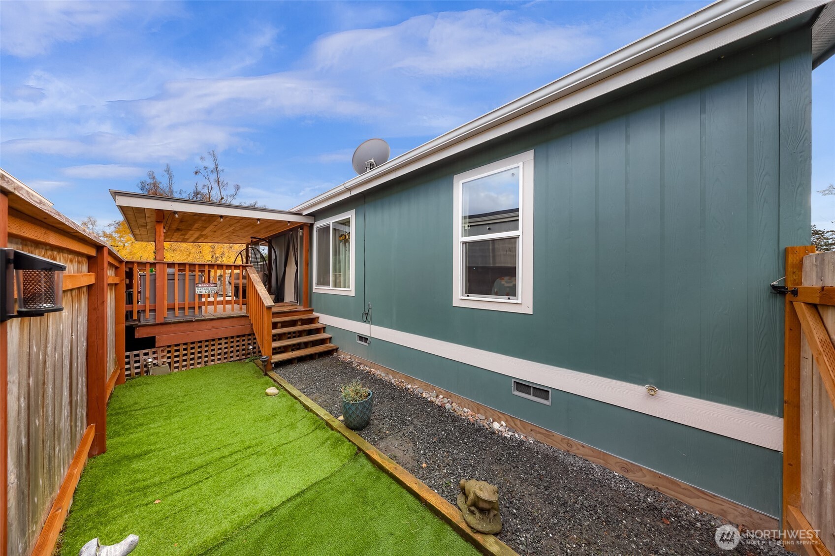 2392 Douglas Road, Unit 57 Ferndale, WA 98248 - Photo 24 of 26 a backyard of a house with wooden floor and fence